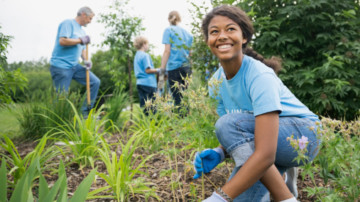 Smiling volunteer working in garden